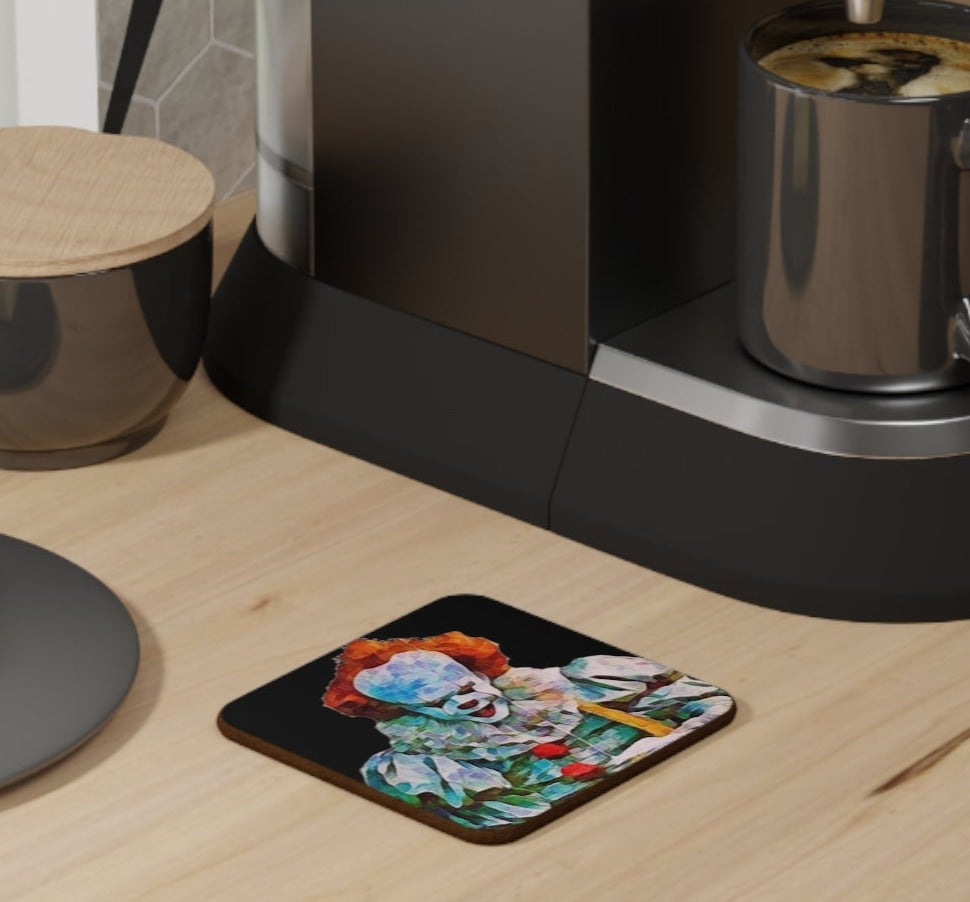 a coffe bnch set up with a coaster with a black background and pennywise he clown