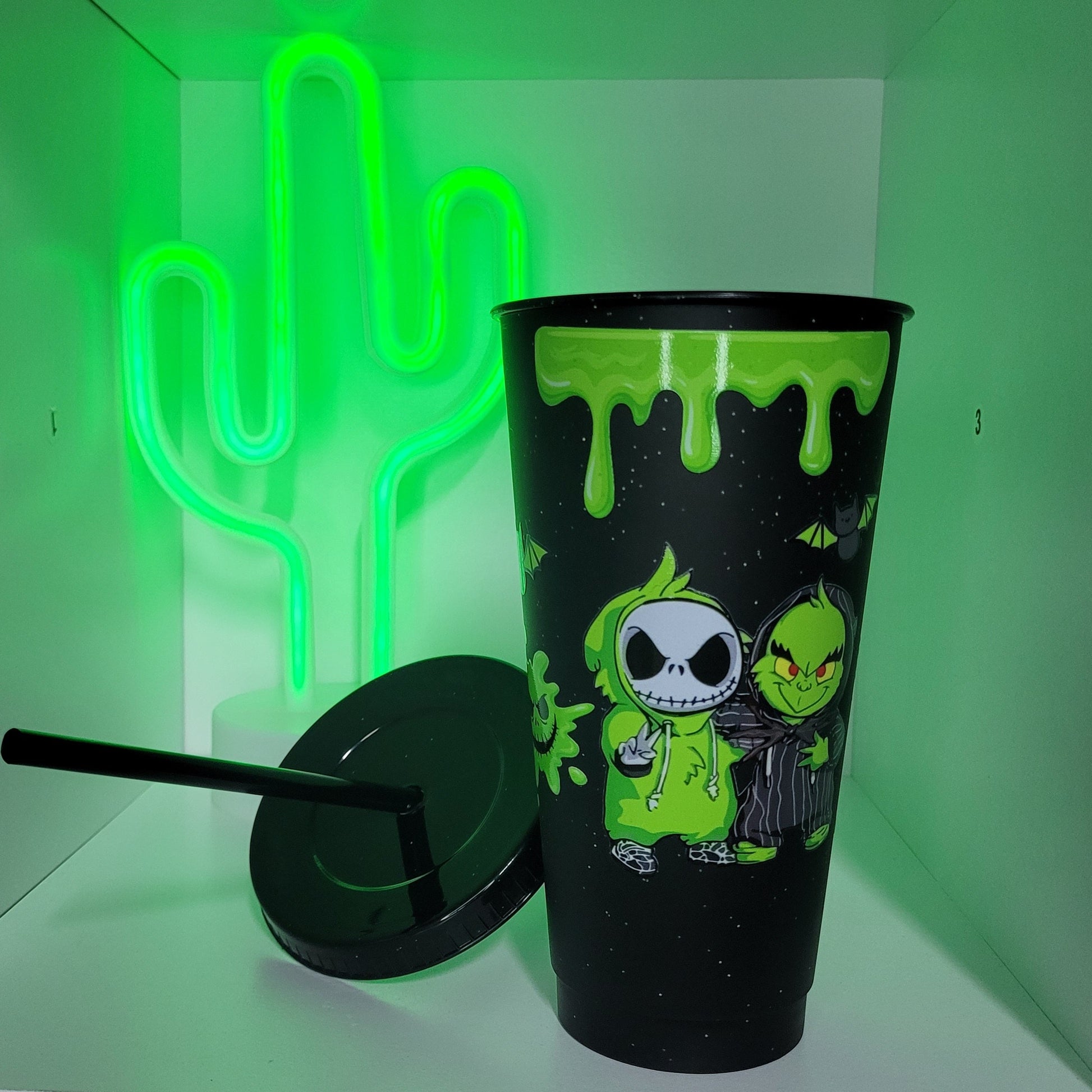 Black plastic tumbler with straw green halloween