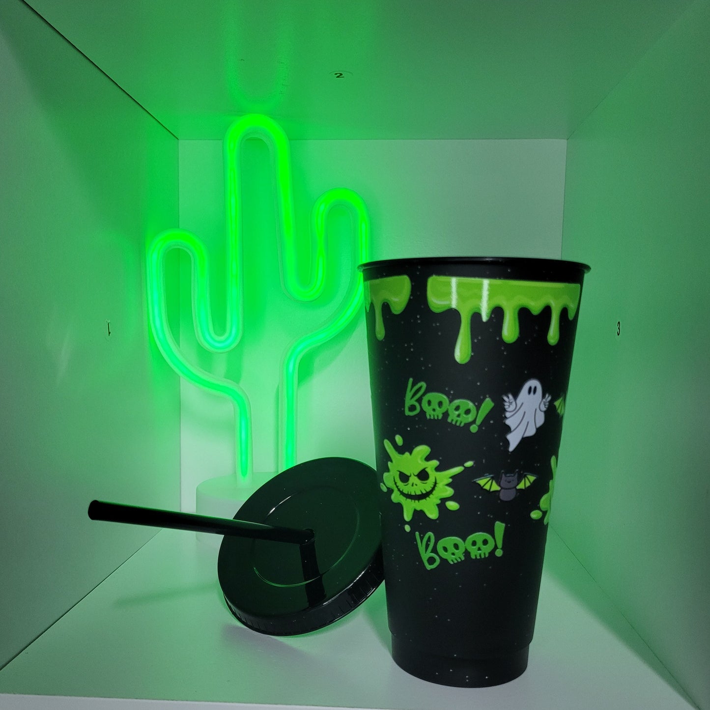 Black plastic tumbler with straw green halloween