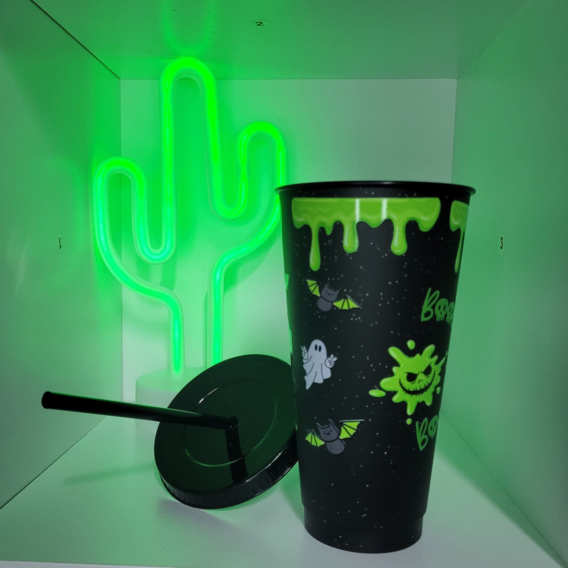 Black plastic tumbler with straw green halloween