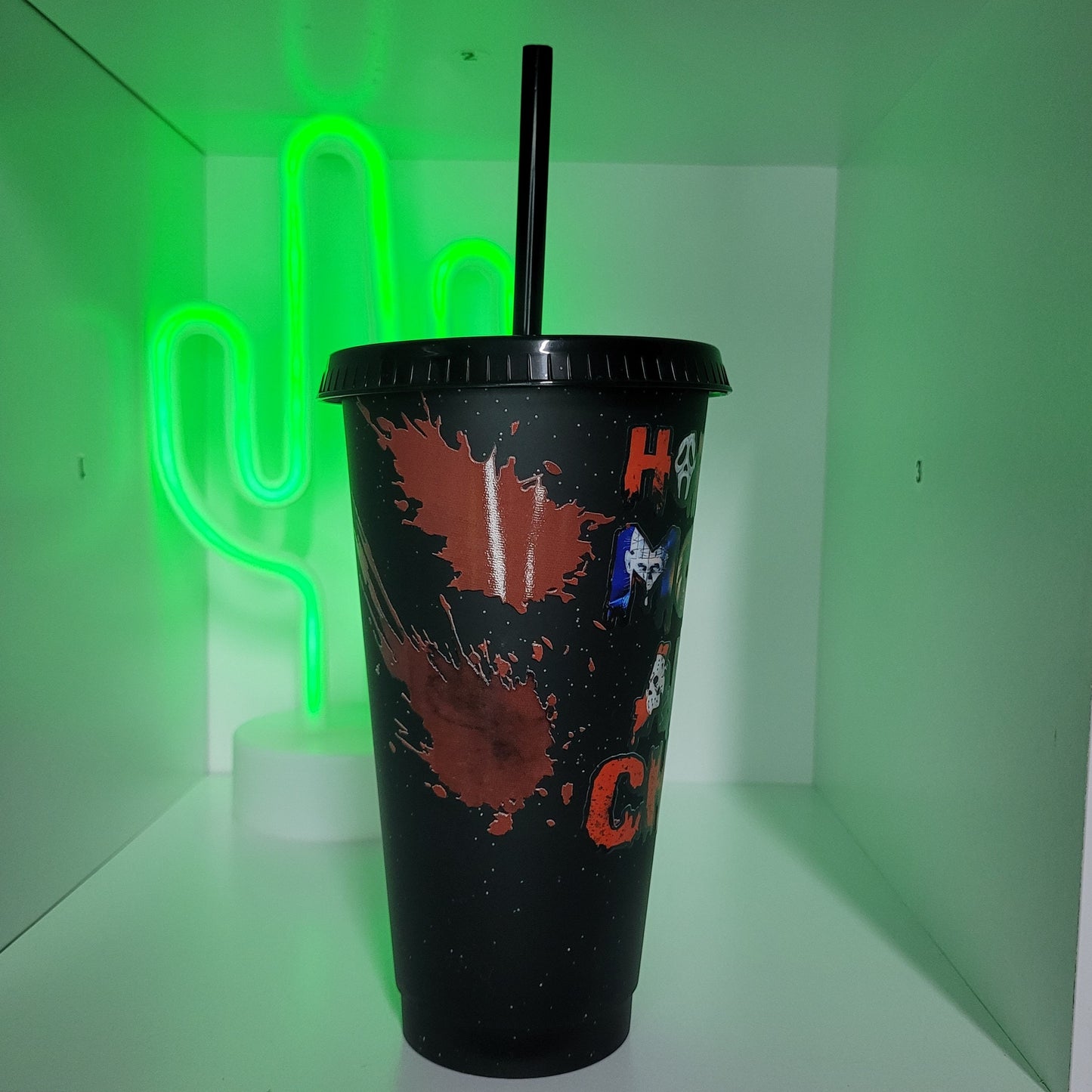 Black plastic tumbler with straw horror movie and chill