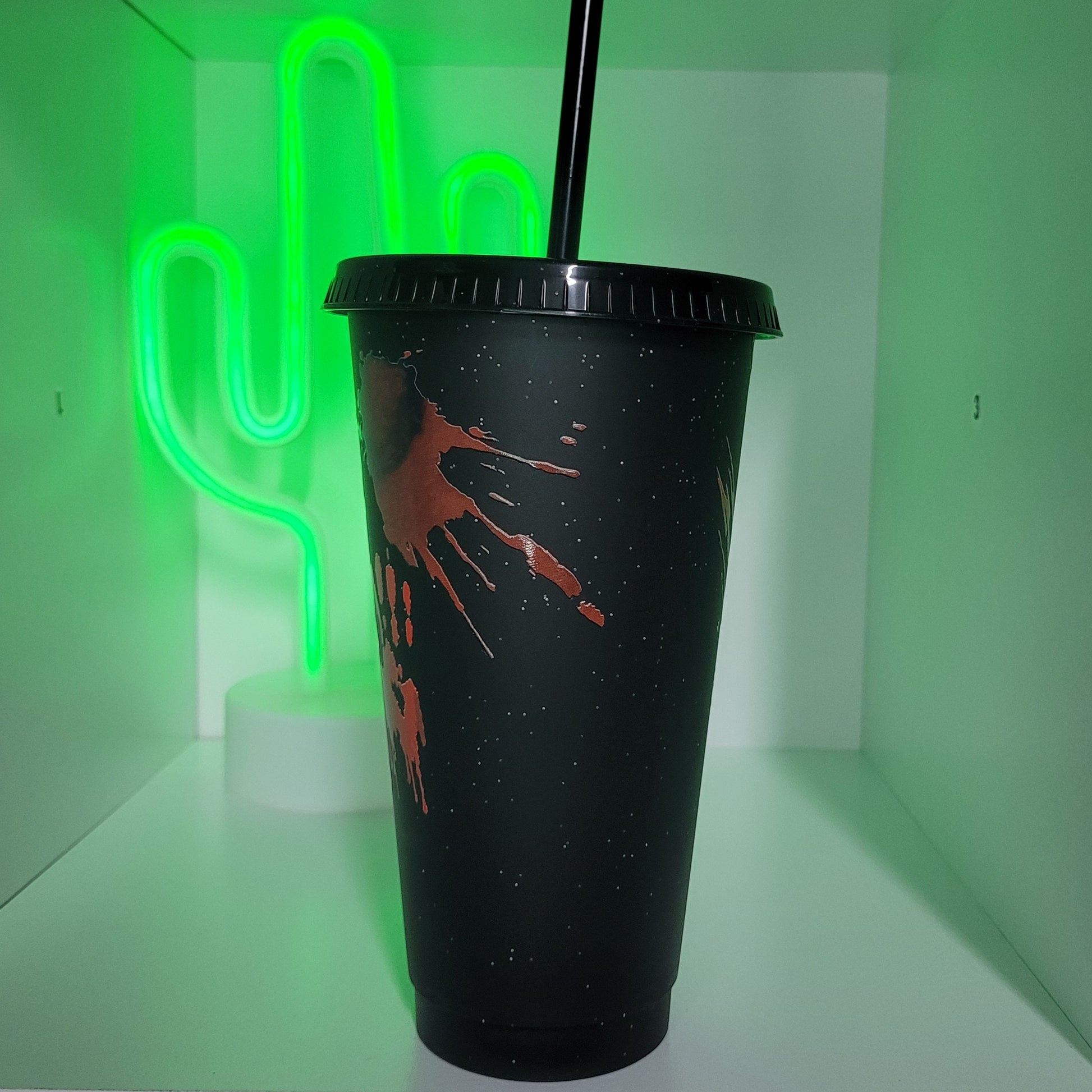 Black plastic tumbler with straw horror movie and chill