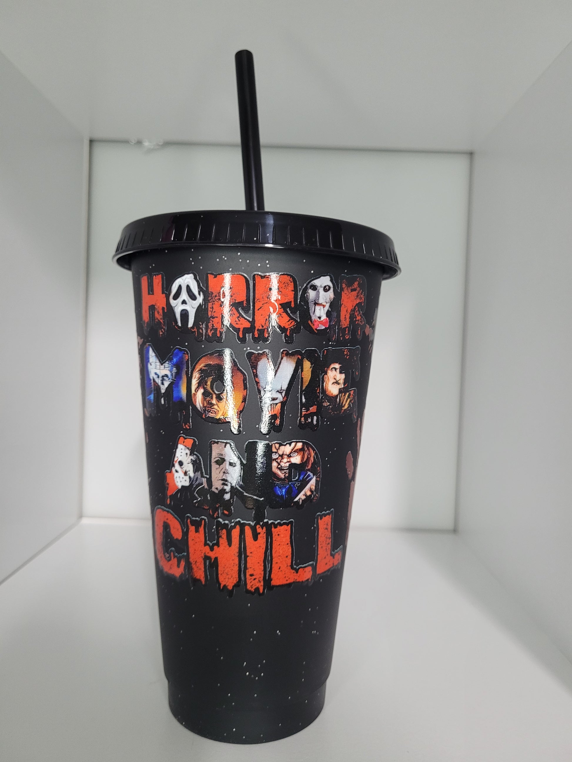 Black plastic with lid and straw horror mtumbler ovie and chill