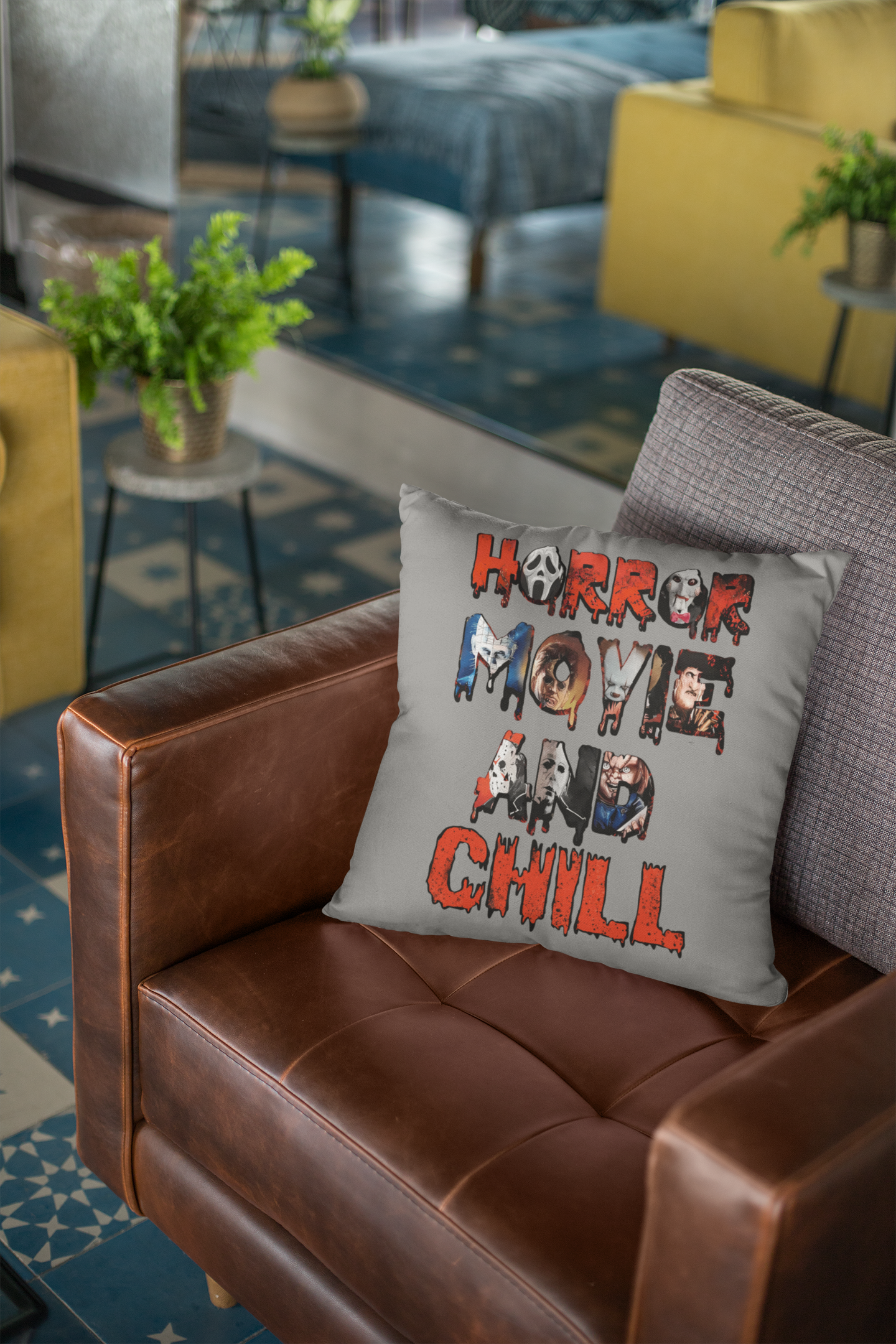 A square cushion with horror movie characters and the words horror movie and chill